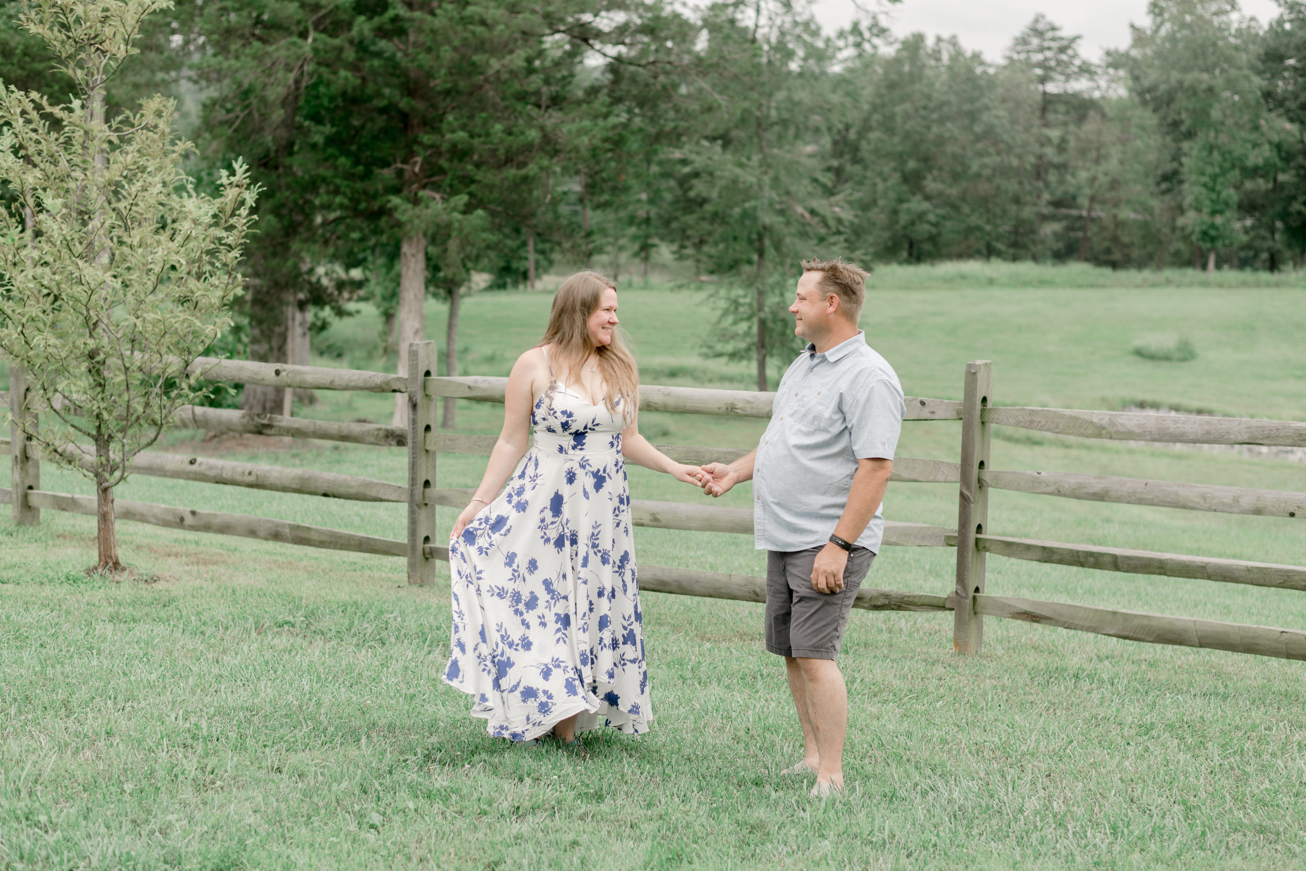 couple taking engagement photos at the winery at bull run