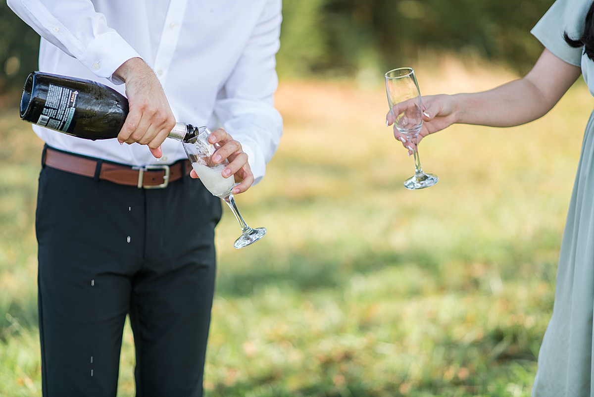 Engagement photos with champagne