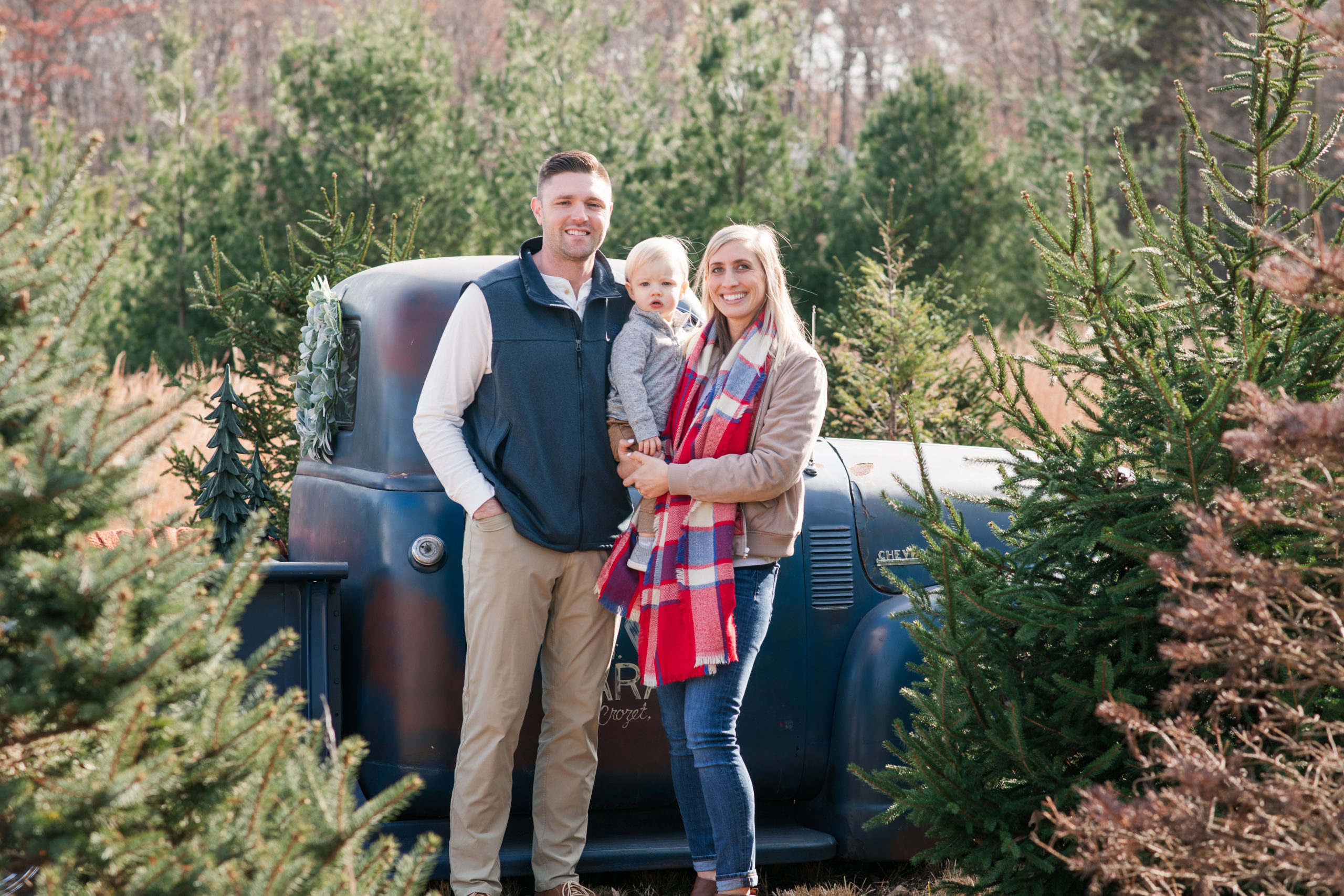 family photo in christmas tree farm