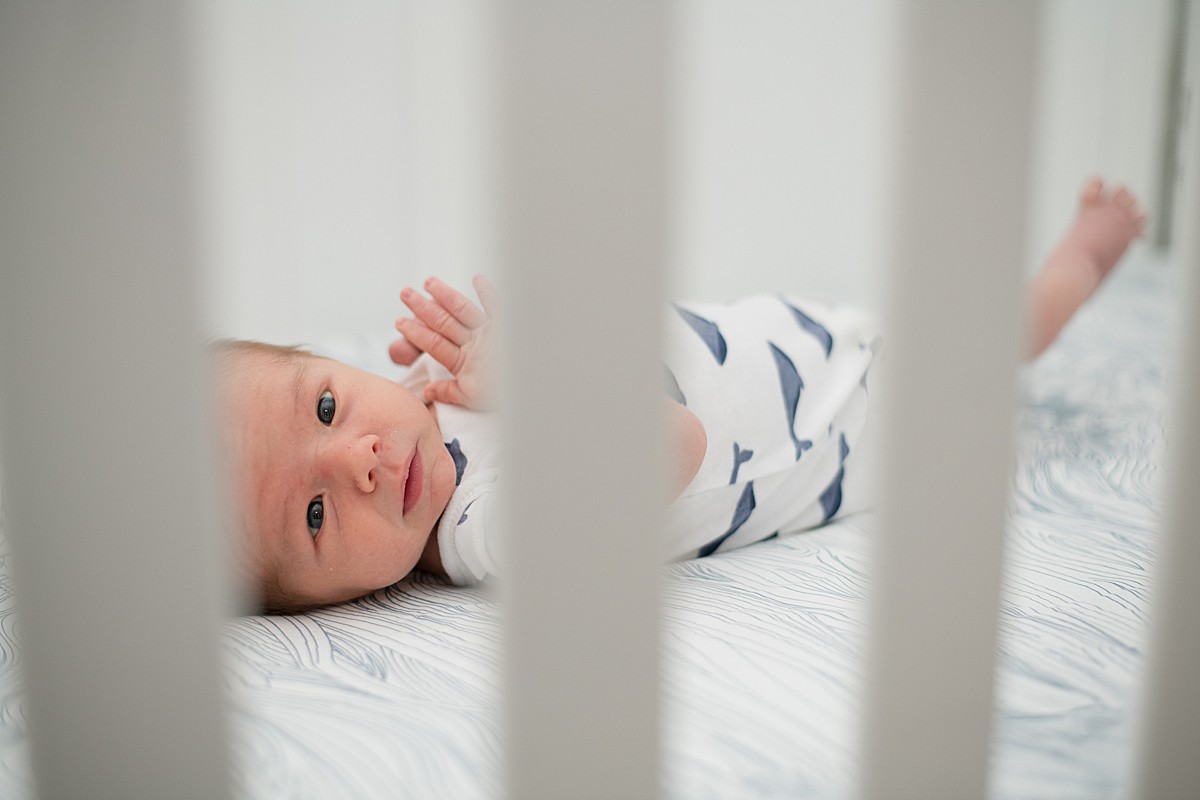 Newborn boy in crib
