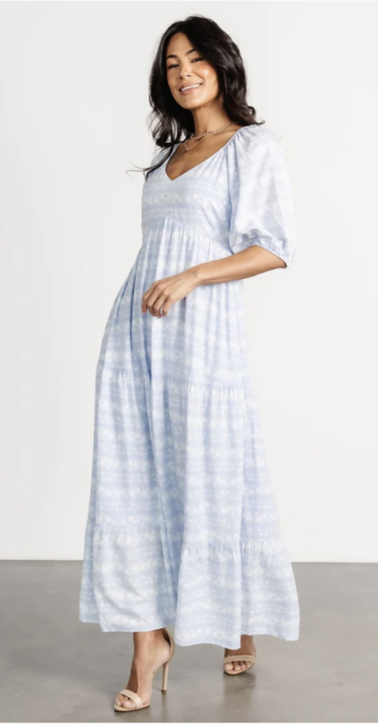 Pale blue and white tie-dye inspired maxi dress with a cinched waist and V-neckline – a breezy choice for summer portraits.
