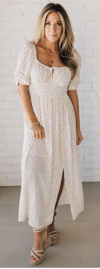 Light beige midi dress with small polka dot pattern, square neckline, and a front slit – understated and lovely for summer photos.