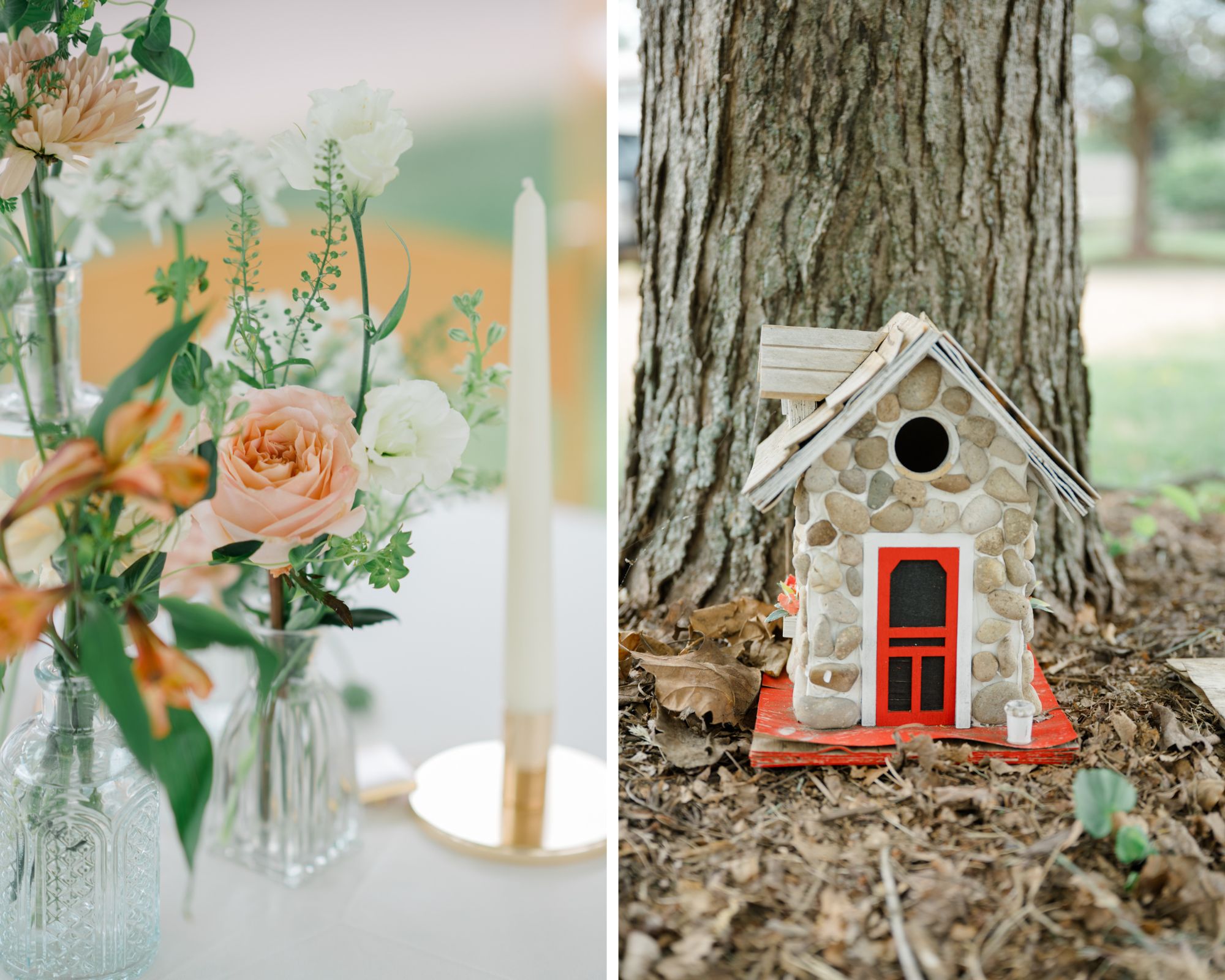 Delicate blush and cream floral arrangements in vintage glass bud vases next to a tapered candle on a reception table, paired with a whimsical stone birdhouse with a red door nestled at the base of a tree.