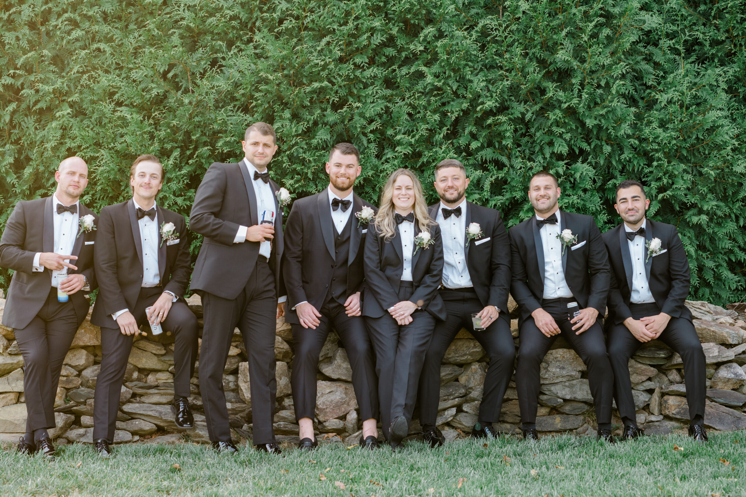 Wedding party posing together in black tie attire during portraits at Gordon Springs in Purcellville, Virginia