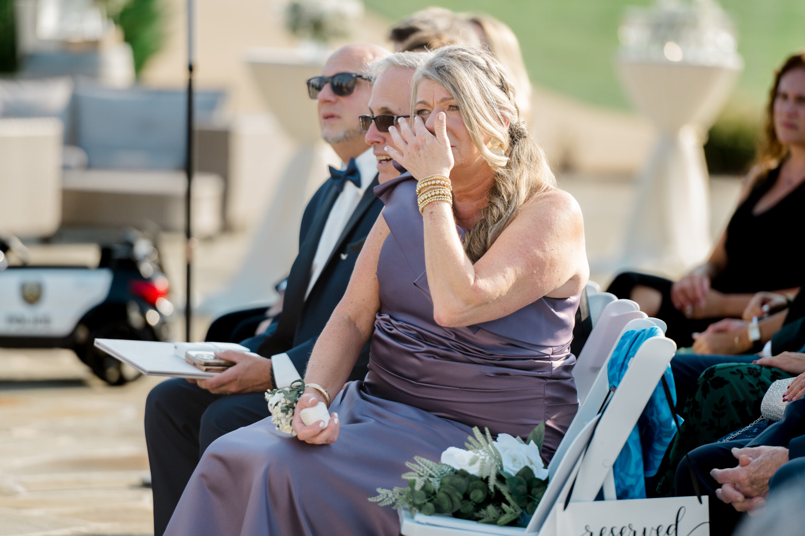 Mother wiping away tears while watching the wedding ceremony during an emotional moment at Gordon Springs